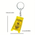 thumbnail image 2 of Llavero acrílico amarillo Funny Caution Slippery When Wet, 2 of 2