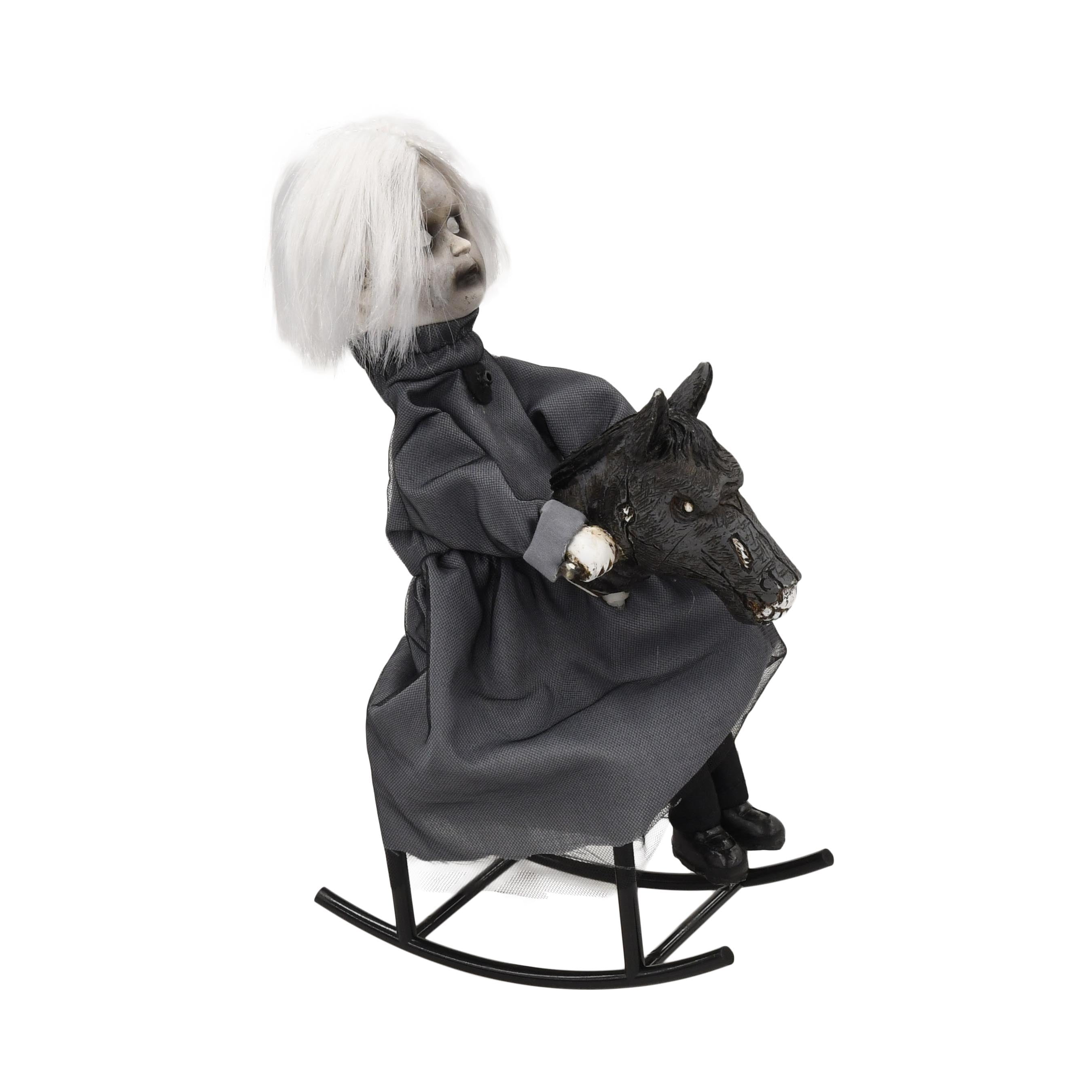scary doll on rocking horse