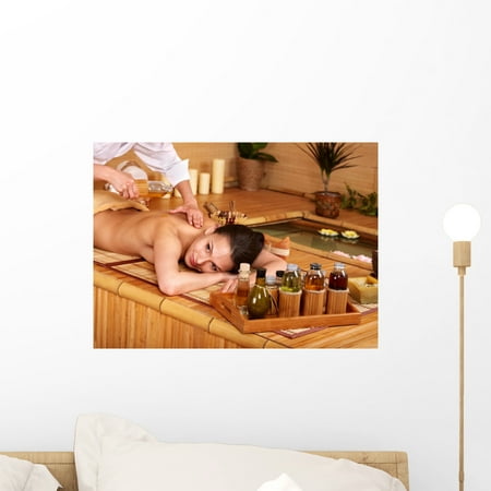 Where To Get Bamboo Sticks Woman Getting Massage Bamboo Wall Mural by Wallmonkeys Peel and Stick Graphic (18 in W x 13 in H) WM135676 ()