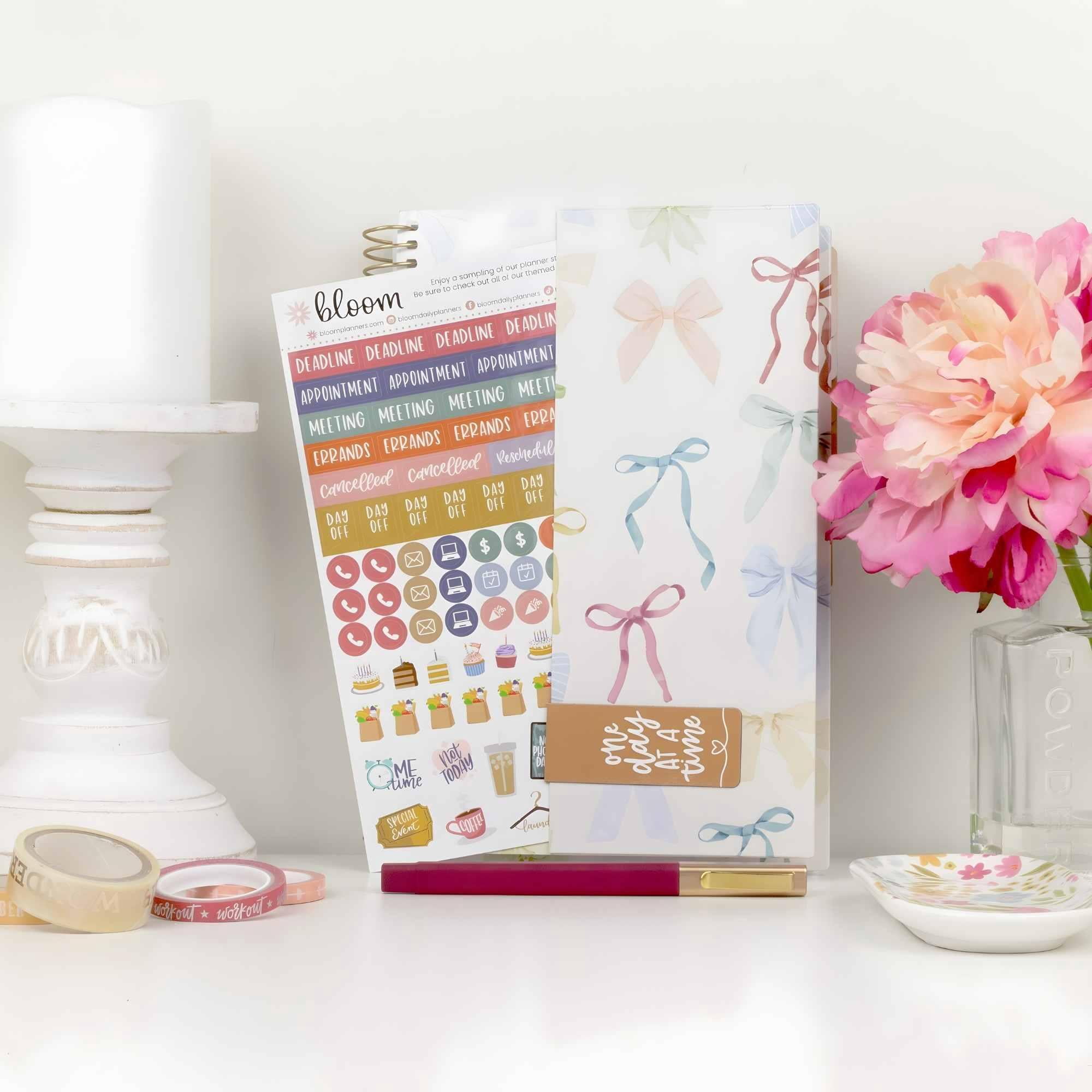 bloom daily planners 2026-2027 Academic Planner, 13 Month Monthly & Weekly Soft Cover, 5.5" x 8.25", Stickers Included, Bows