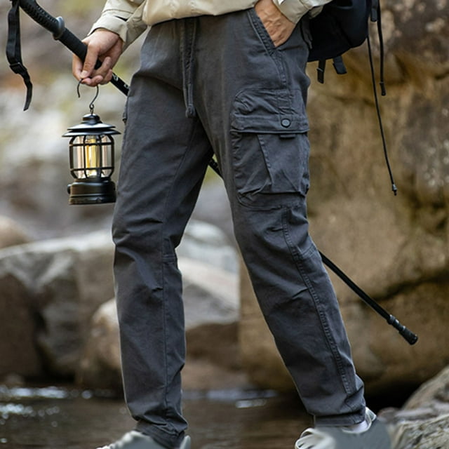 Pantalones largos de moda para hombre, casuales, de color sólido, con bolsillos y cremallera, cintura elástica, de poliéster.