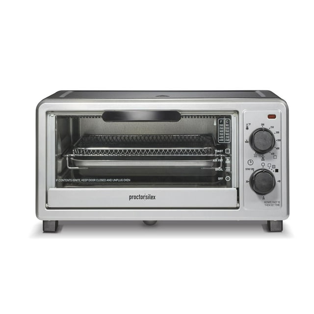 Silver Proctor Silex Simply-Crisp air fryer toaster oven with 4-slice capacity, featuring temperature and timer dials on the right side and a wire rack inside.