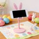 thumbnail image 5 of Soporte ajustable para teléfono Bunny – Elevador telescópico, diseño de conejo de Pascua, plástico, blanco azul rosa, base estable para tableta móvil, 5 of 6