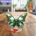 thumbnail image 6 of Rotating acrylic ornament featuring a vibrant green butterfly with intricate silver filigree and a dreamy pastel background, capturing magical realism and elegance, 6 of 6