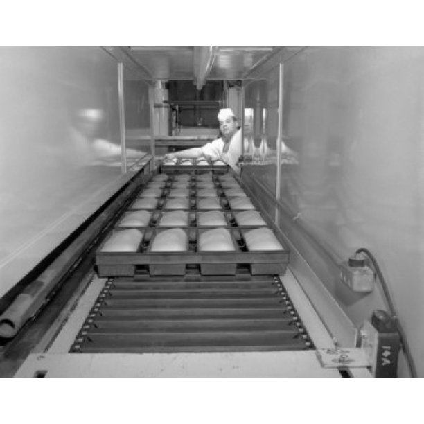 Baker baking breads in a bakery Nissen Bakery Worcester Massachusetts