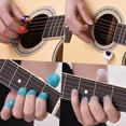 thumbnail image 4 of Kit d'Accessoires de Guitare Protecteurs Comprend 20 Pcs Protecteurs de Doigts de Guitare en Silicone + 10 Pcs Pics de Guitare + 4 Pcs Pics Pouce & Doigt + Support de Pic + 2 Pcs Clips de Page de Musique avec, 4 of 6