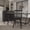 Black, variant on Emma + Oliver Set of Two Premium Solid Wood Spindle Back Armless Dining Chairs in Black with Saddle Seats and Felt Floor Protectors