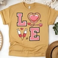 thumbnail image 1 of Nurse Love T-Shirt with Stethoscope and Syringe Graphic, Gold, Size M, 1 of 6