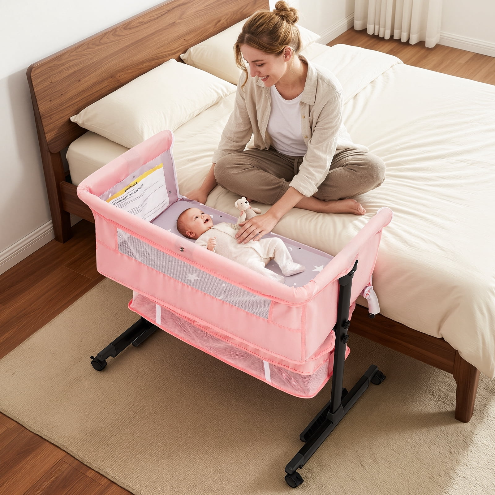 kmaier Baby Bassinet Bedside Crib Foldable Portable with Adjustable Height, Wheels, and Storage Basket,Pink
