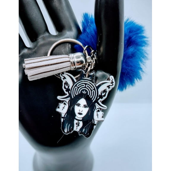 The Trio Acrylic Keychain With Fur And Tassel charm