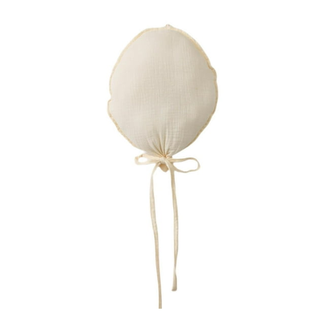 Una decoración minimalista con globos de tela para tomar fotografías, reutilizable y fácil de colgar. Beige