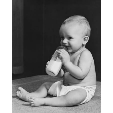 A baby drinking from a baby bottle Stretched Canvas -  (18 x