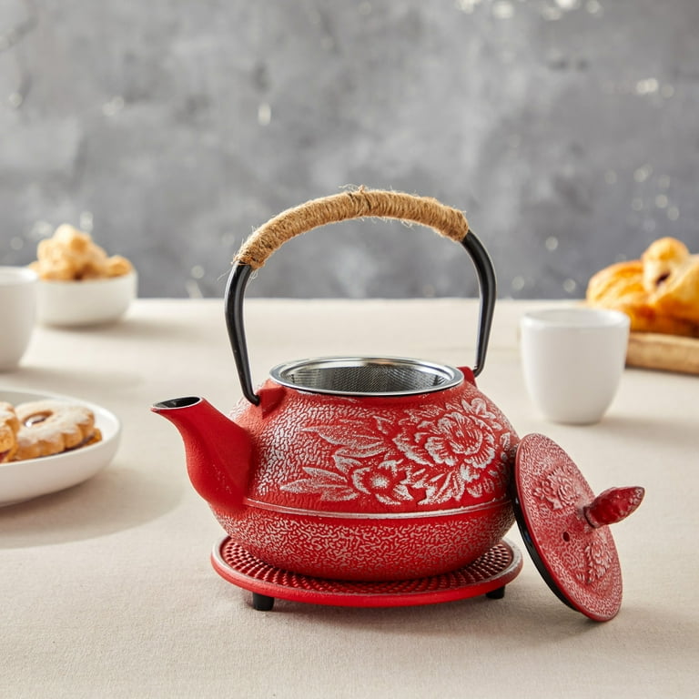 Tetsubin Cast Iron Tea Pot, brewing some Jasmine. Never used a cast iron tea  pot, the little placard that came with the set claims it can be used over a  fire. If