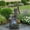 Style-2, variant on PatioWhisper 23.6" Tiered Cascading Jar Water Fountain with Planter, Resin Outdoor Fountain for Patio Yard Garden Decor