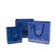 thumbnail image 1 of Juego de bolsas de regalo con diseño floral azul con lazos de cinta, 3 tamaños, 1 of 3
