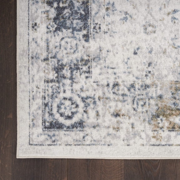 9' X 12' Blue and Ivory Floral Medallion Power Loom Distressed Washable Area Rug