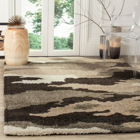 SAFAVIEH Florida Edwin Camouflage Shag Area Rug  Beige/Multi  5 3  x 7 6 Florida Shag Rug Collection. Plush And Dense Pile Perfect For Living And Bedroom Décor. Lavish natural motifs  colored in rich earth tones of ivory  beige  brown and grey  drift across soft plush pile of this Florida shag by Safavieh. The distinctive high-low pile is soft underfoot while also adding alluring textures and decorative dimension to urban or metro-chic furnishings. Power-loomed using durable synthetic yarns for a long-lasting charm and beauty. Elegantly designed  each rug provides comfort and luxury to complement your style. Durably construction  these shag rugs are the perfect addition in your home for a chic upgrade.