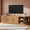 Natural, variant on Farmhouse TV Stand, Sliding Tambour Door Media Console for TVs up to 75", Fluted Wooden Cabinet with Adjustable Shelves, Golden Handle, Cable Management, Walnut
