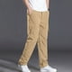 thumbnail image 1 of Pantalones largos de poliéster para hombre, de color liso, informales, con botones, cintura elástica y múltiples bolsillos., 1 of 9