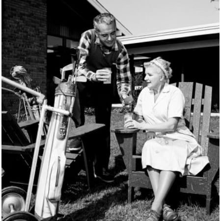 Mid adult man and mother having break from playing golf Canvas Art -  (24 x 36)