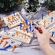 thumbnail image 2 of Juego de mesa de madera surtido con 5 tableros de madera de diferentes estilos, piezas de plástico y dados. Incluye juego de ingenio y rompecabezas., 2 of 5