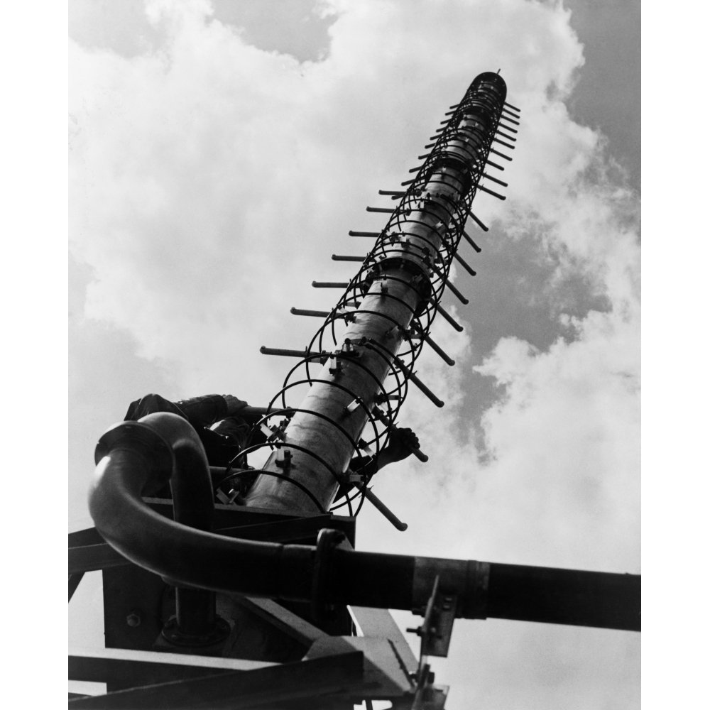 Worker Climbing A Helical Television Antenna Developed By General