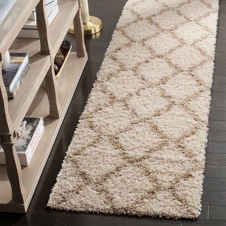 Safavieh Daley Geometric Plush Shag Area Rug or Runner SAFAVIEH Dallas Shag SGDS257B Ivory / Beige Rug Inspired by classic shag rugs in European homes  SAFAVIEH s Dallas Shag Collection is a stylish transitional floor covering that blends chic modern design with expert construction. Boasting a 2-inch pile height  this rug provides sink-in comfort underfoot while imbuing a sense of sumptuous relaxation. Rug has an approximate thickness of 1.5 inches. For over 100 years  SAFAVIEH has set the standard for finely crafted rugs and home furnishings. From coveted fresh and trendy designs to timeless heirloom-quality pieces  expressing your unique personal style has never been easier. Begin your rug  furniture  lighting  outdoor  and home decor search and discover over 100 000 SAFAVIEH products today.