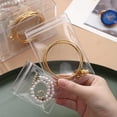 thumbnail image 4 of Organizador de Joyas de Acrílico, Organizadores de Joyas Transparentes y Almacenamiento con 60 Bolsas, para Aretes, Anillos, Pulseras y Collares, 4 of 5