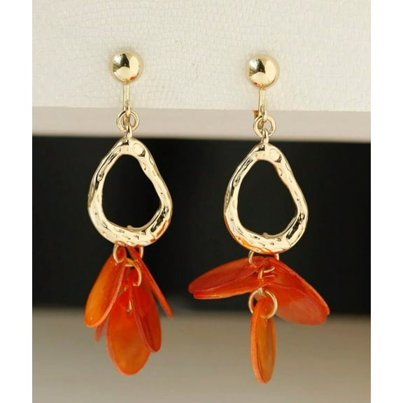 Clip on 2 1/2" gold odd shaped hoop earrings with orange shell circles