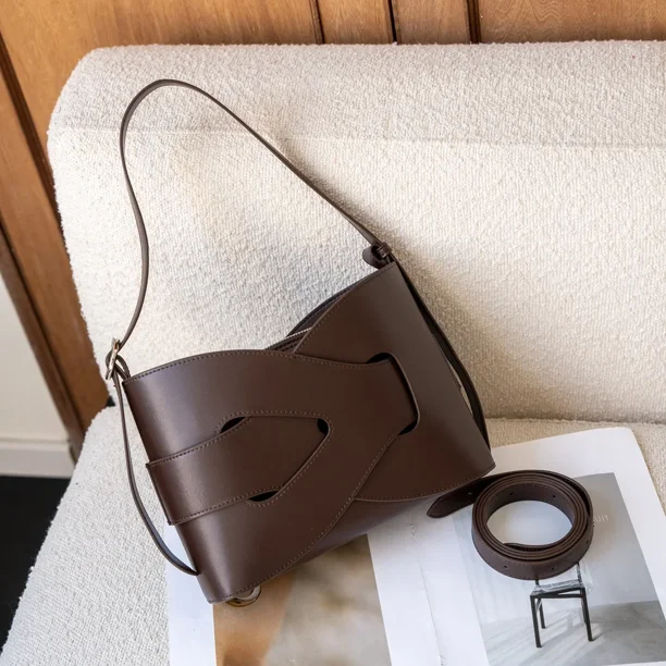Primavera 2025 nueva moda Retro Hollow Kink bolso tejido geométrico de cuero de alta gama bolso de mujer bandolera de un solo hombro