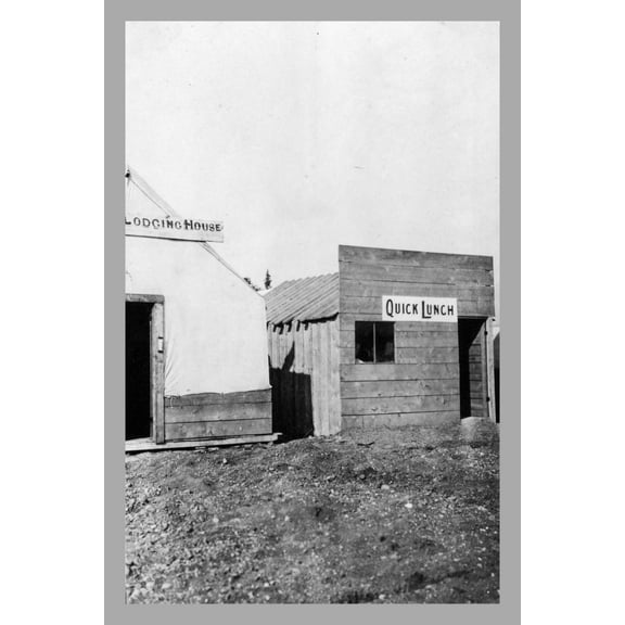 Print: Lodging House And Quick Lunch Shacks On A Dirt Road, circa 1900
