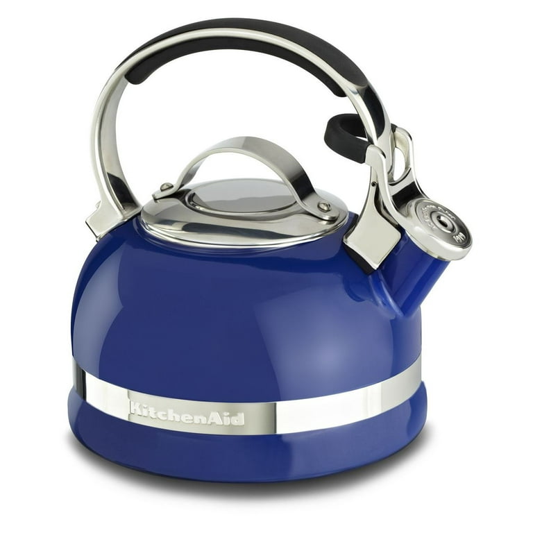 metal kettle on a whirlpool electric stove top boiling water in a