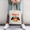 thumbnail image 2 of Stylish Canvas Tote Bag with ' Don ' t Quit ' in bold red featuring a vibrant sunset design in warm hues perfect for shopping and travel, 2 of 4