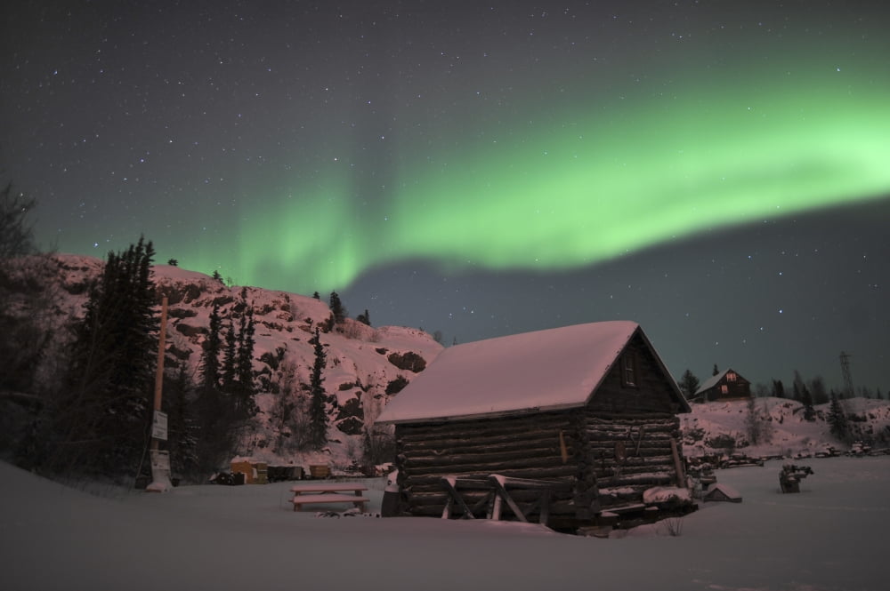 Aurora borealis over a cabin yellowknife northwest territories