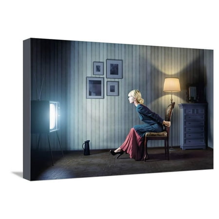 Young Woman Sitting on a Chair in Vintage Interior and Watching Retro TV Stretched Canvas Print Wall Art By (Best Chair For Watching Tv)