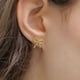 thumbnail image 3 of Arete broquel dorado CYRA modelo lazo, 3 of 3