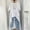 White, variant on Women's Solid Color Minimalist Style Loose Crew Neck Blouse with Adjustable Sleeves & Asymmetric Hem Gray,S