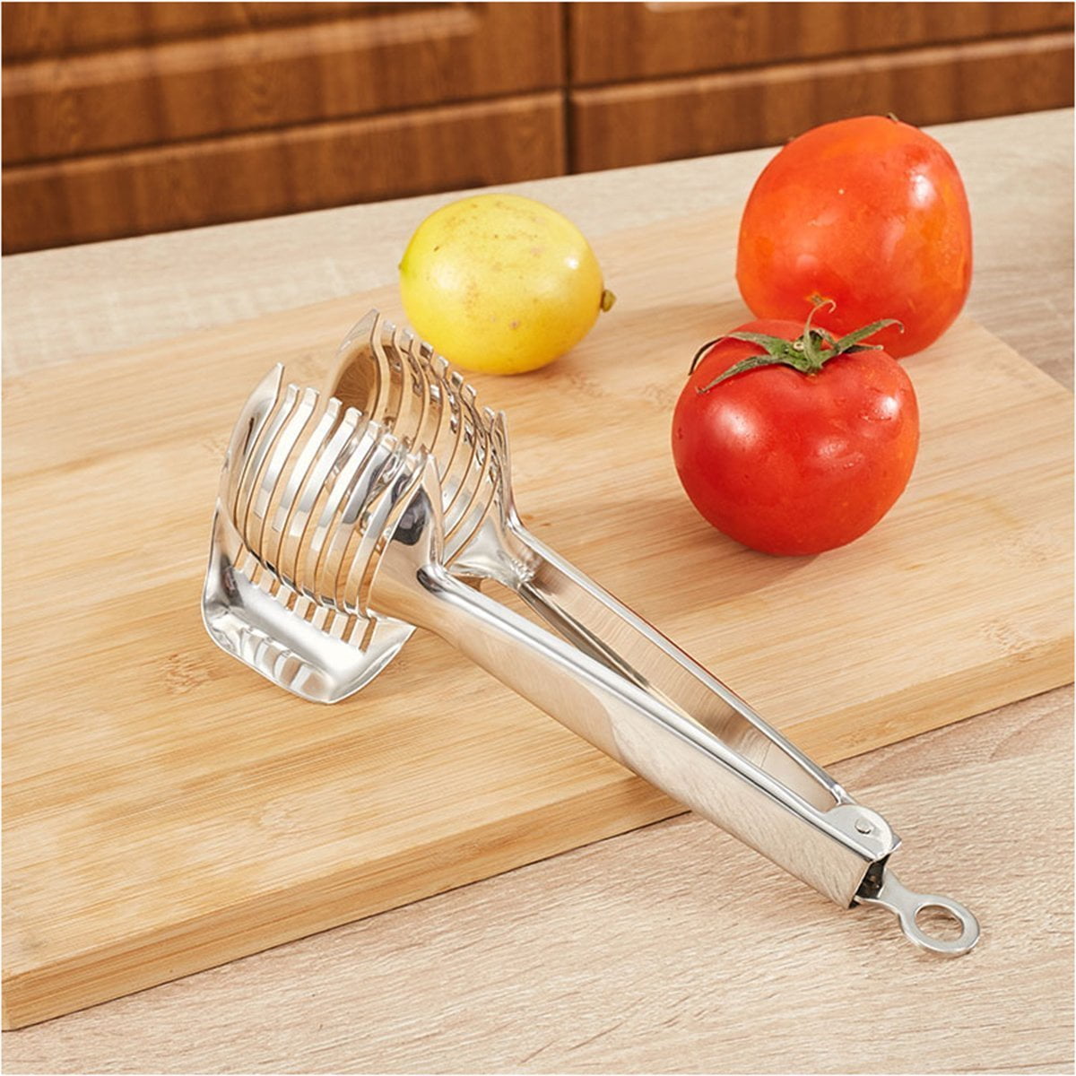 Dropship 1pc Tomato Lemon Slicer Holder, Round Fruits Onion Shredder Cutter  Guide Tongs With Handle, Stainless Steel Kitchen Cutting Potato Lime Food  Stand to Sell Online at a Lower Price