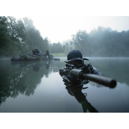 Special operations forces combat diver transits the water armed with an assault rifle Poster