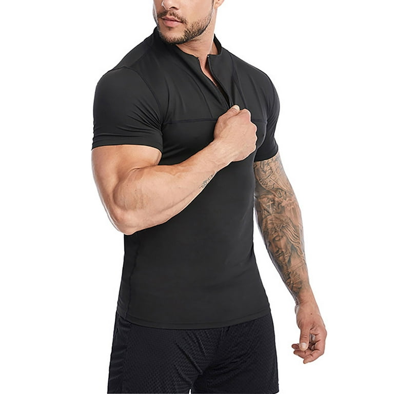 Muscular Man in Black Compression Sportswear on Gray Background