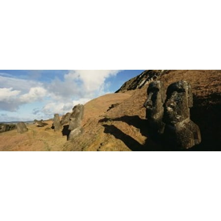 Low angle view of Moai statues Tahai Archaeological Site Rano Raraku Easter Island Chile Canvas Art - Panoramic Images (15 x