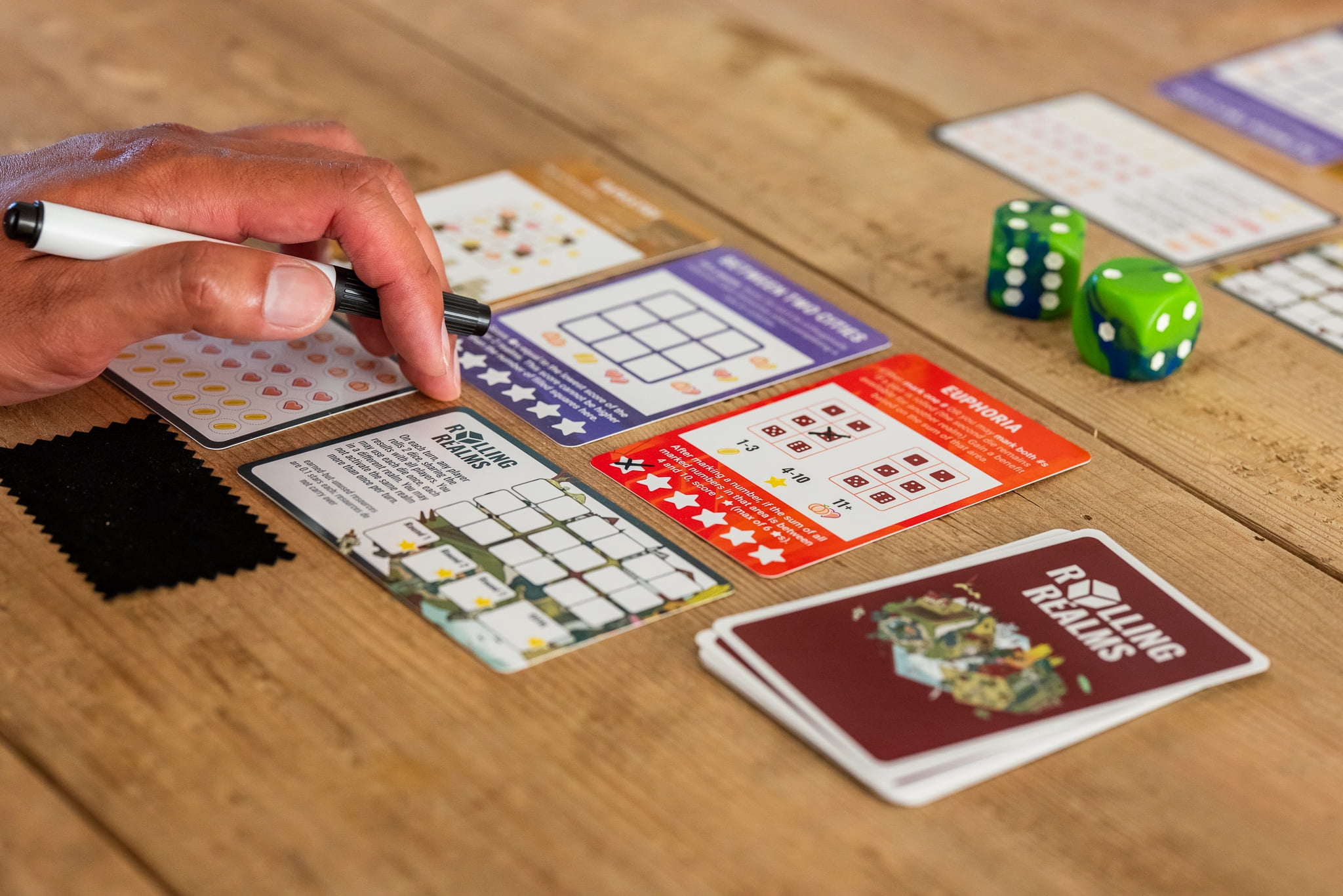 Rolling Realms by Jamey Stegmaier - A Roll-and-Write Strategy Board Game from Stonemaier Games