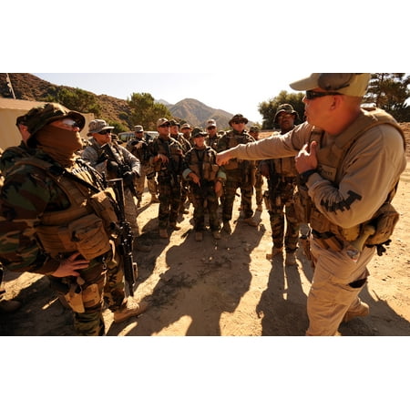LAMINATED POSTER Service members receive a weapons brief from an instructor assigned to the Tactical Firearms Traini Poster Print 24 x