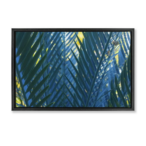 Stupell Industries Blue Palm Fronds Plants & Flowers Photography Black Floater Framed Canvas Art Print Wall Art, 25 x 17