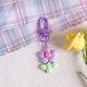 thumbnail image 1 of Llavero con tulipán de resina, colgante con forma de girasol y corazón para niña, bonito adorno para colgar en el bolso, adornos para auriculares, 1 of 6