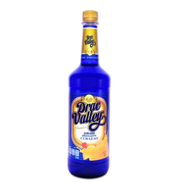 caja de 12 jarabe curazao drac valley 1 l curazao drac valley botella azul translúcida, vista frontal, 1 L con etiqueta dorada y logo Drac Valley en script, tapa dorada e ilustración de fruta; ideal para cocteles. Venta solo a mayores de edad.