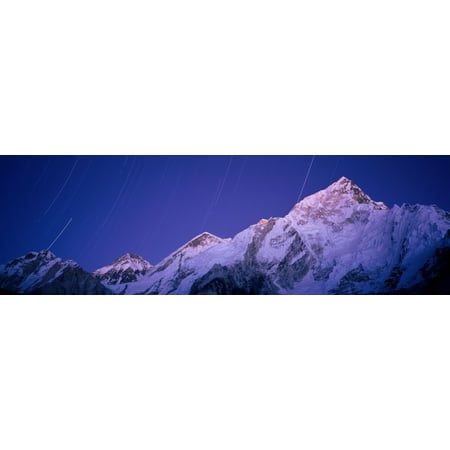 Star trails over snowcapped Nuptse and Mt Everest range Everest Base Camp Trek Khumbu Nepal Poster