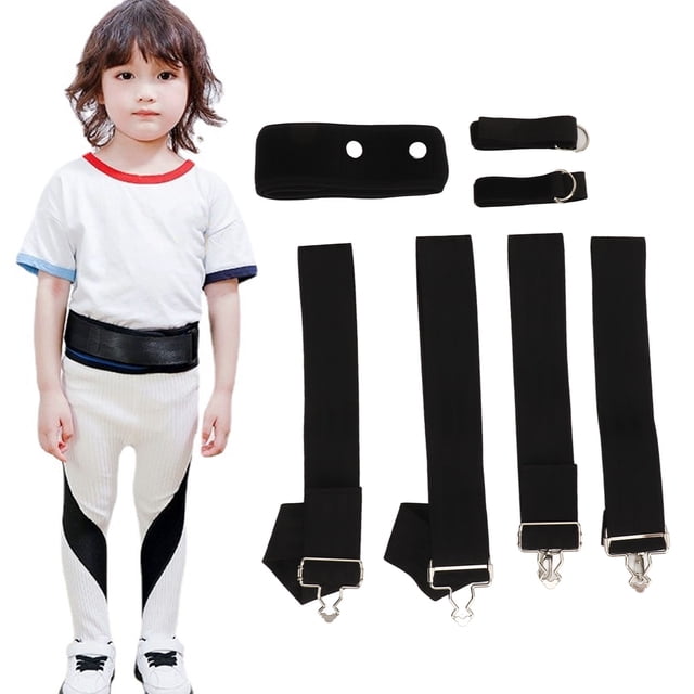 cinturón corrector de postura de pierna, para niños, ajustable, cómodo, ligero, pediátrico, banda para enderezar piernas Vista frontal: set negro con un niño usando la banda alrededor de la cadera; junto a él cuatro tirantes largos con hebillas metálicas, una pieza de neopreno con dos ojales y dos correas cortas con anillas en D. Materiales visibles nylon y neopreno; importado. A menudo usado como soporte de alineación durante paseos y actividades cortas.