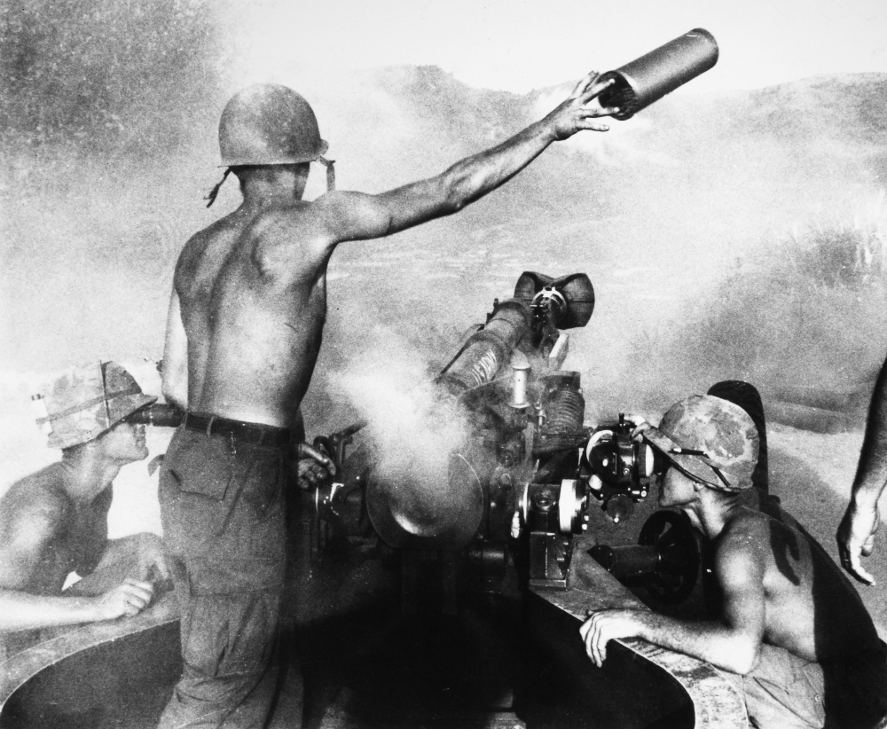 Vietnam War Artillery. Nan American Artilleryman Discards A Spent Shell
