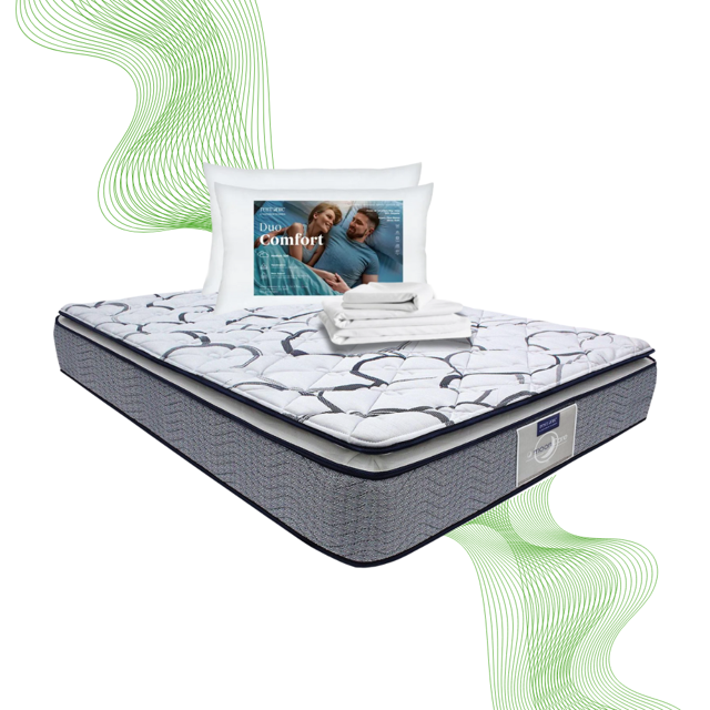 colchon king size restonic confort ortopedico 2 almohadas hipoalergenicas sabanas frias vista 3/4 frontal de colchón King Size Restonic con tapizado acolchado blanco de patrón geométrico, faldón gris con costura lateral y etiqueta Restonic; encima dos almohadas blancas hipoalergénicas y sábanas blancas dobladas; también suele emplearse para vestir la cama principal por su tamaño y presentación.